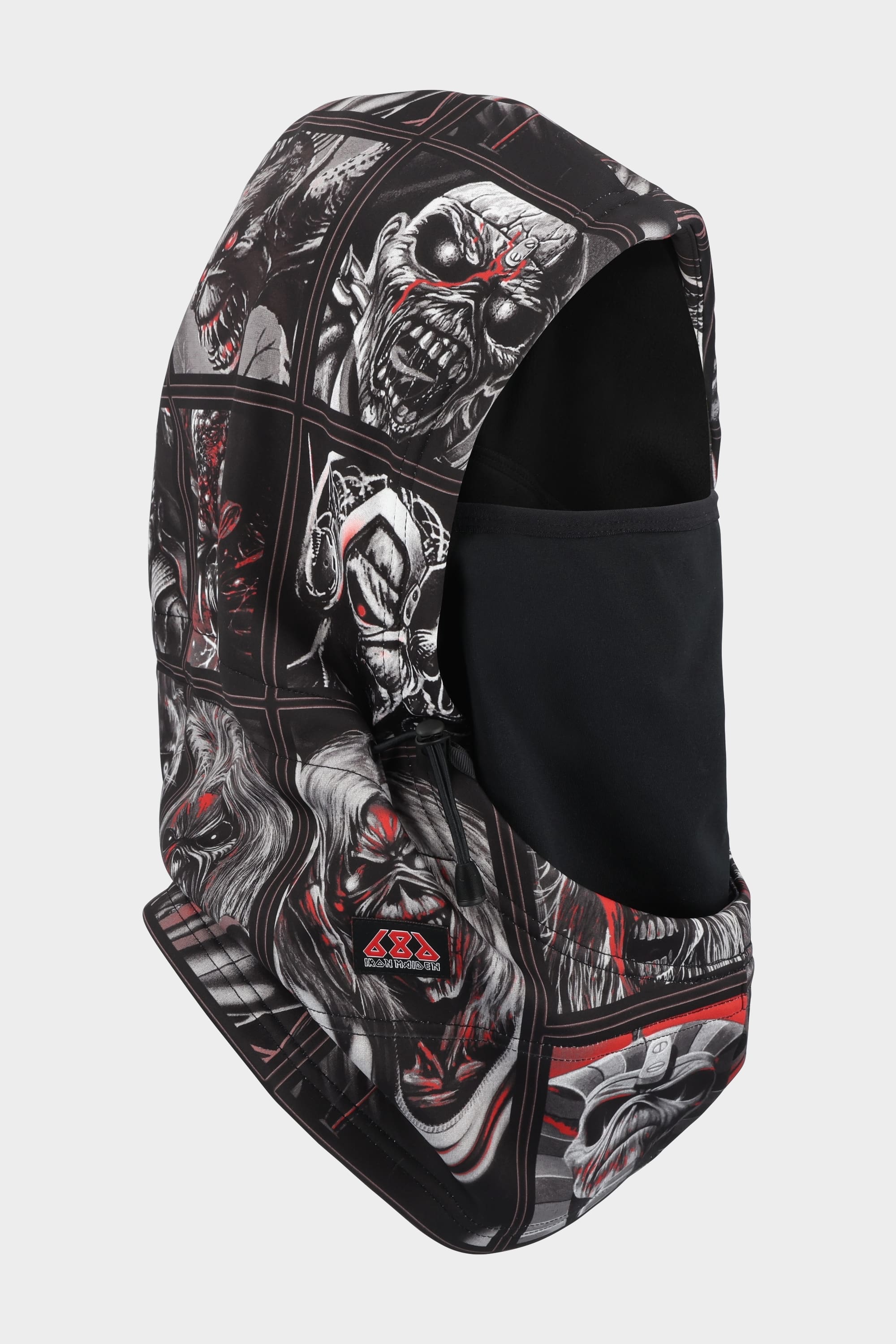 The 686 Patriot Bonded Hood by 686 is a black balaclava featuring comic-style monstrous faces in red, white, and gray. Made from lightweight DWR fleece, it offers comfort with a high, fitted hood design and black face covering for versatile headwear.
