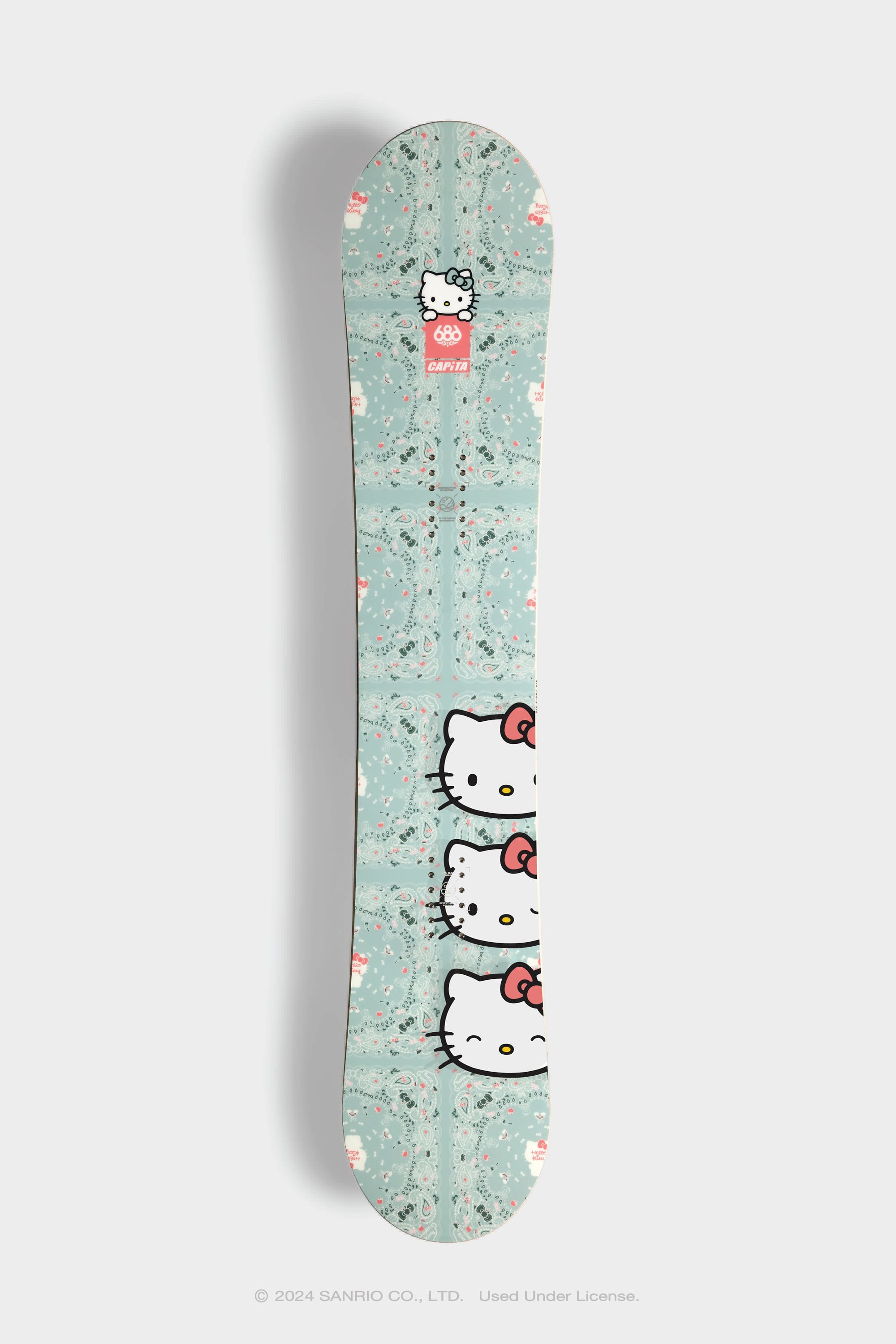The 686 x Hello Kitty x CAPiTA Paradise Snowboard features a mint green, all-terrain freeride design with Hello Kitty faces, red bows, pink and white accents—easy to ride yet stable and supportive for any adventure.