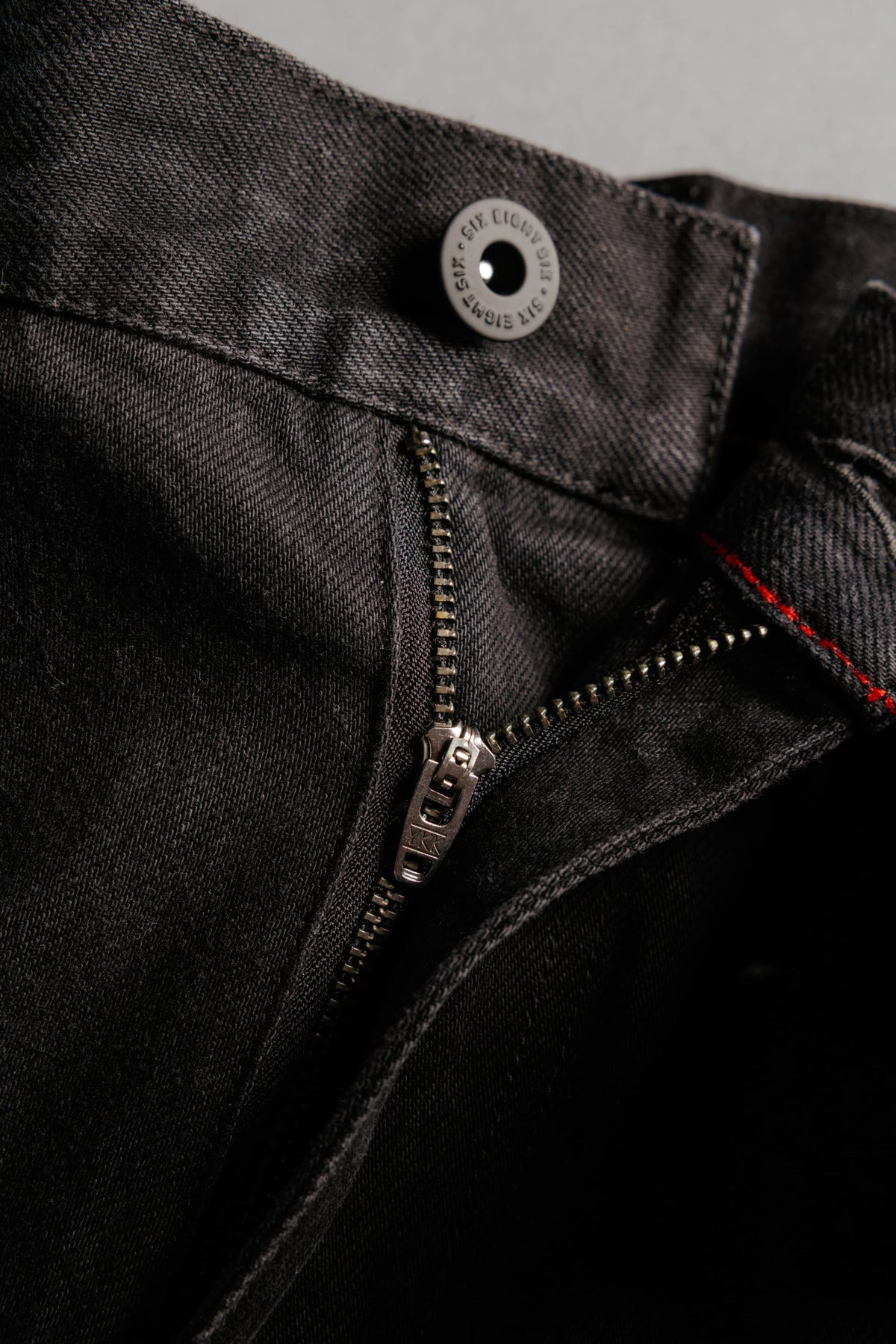 Close-up of the button fly and metal zipper on 686 Men’s Unwork® Hammerhead Denim Pant utility work jeans.