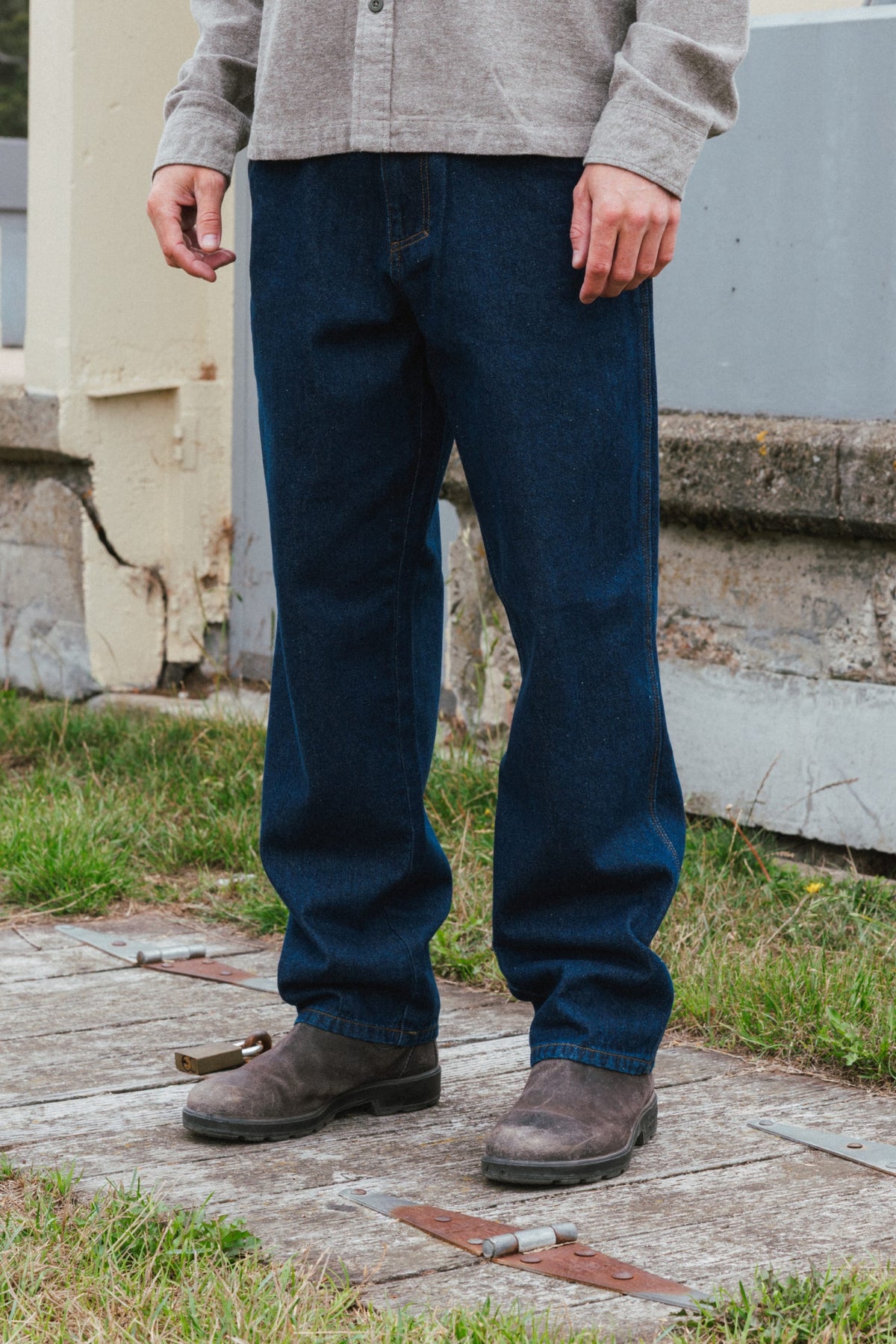 Person wearing 686 Men’s Unwork® Hammerhead Denim Pant and grey suede boots.