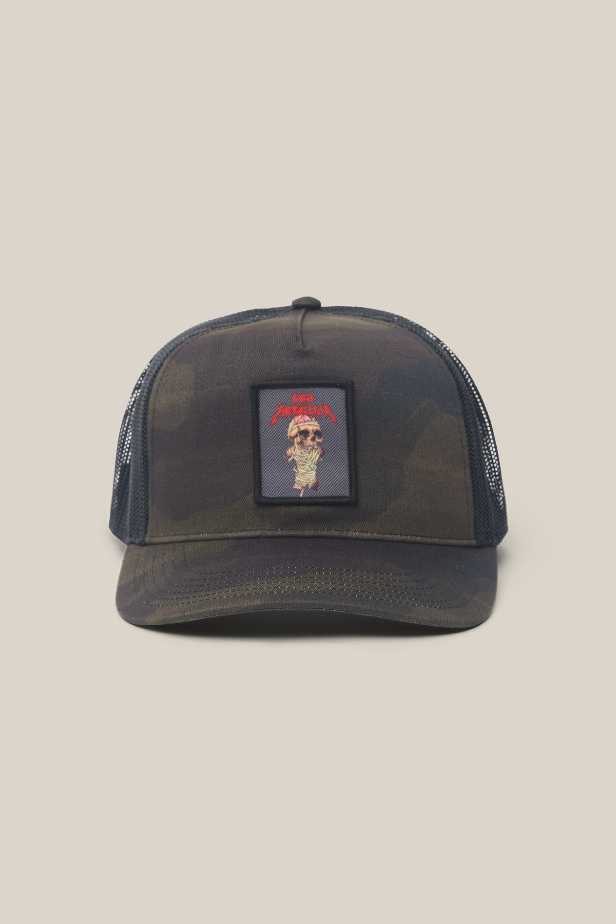 686 Mid Pro Metallica Unstructured Hat featuring a camo design, black mesh back, and a front patch with a skull graphic and red text.