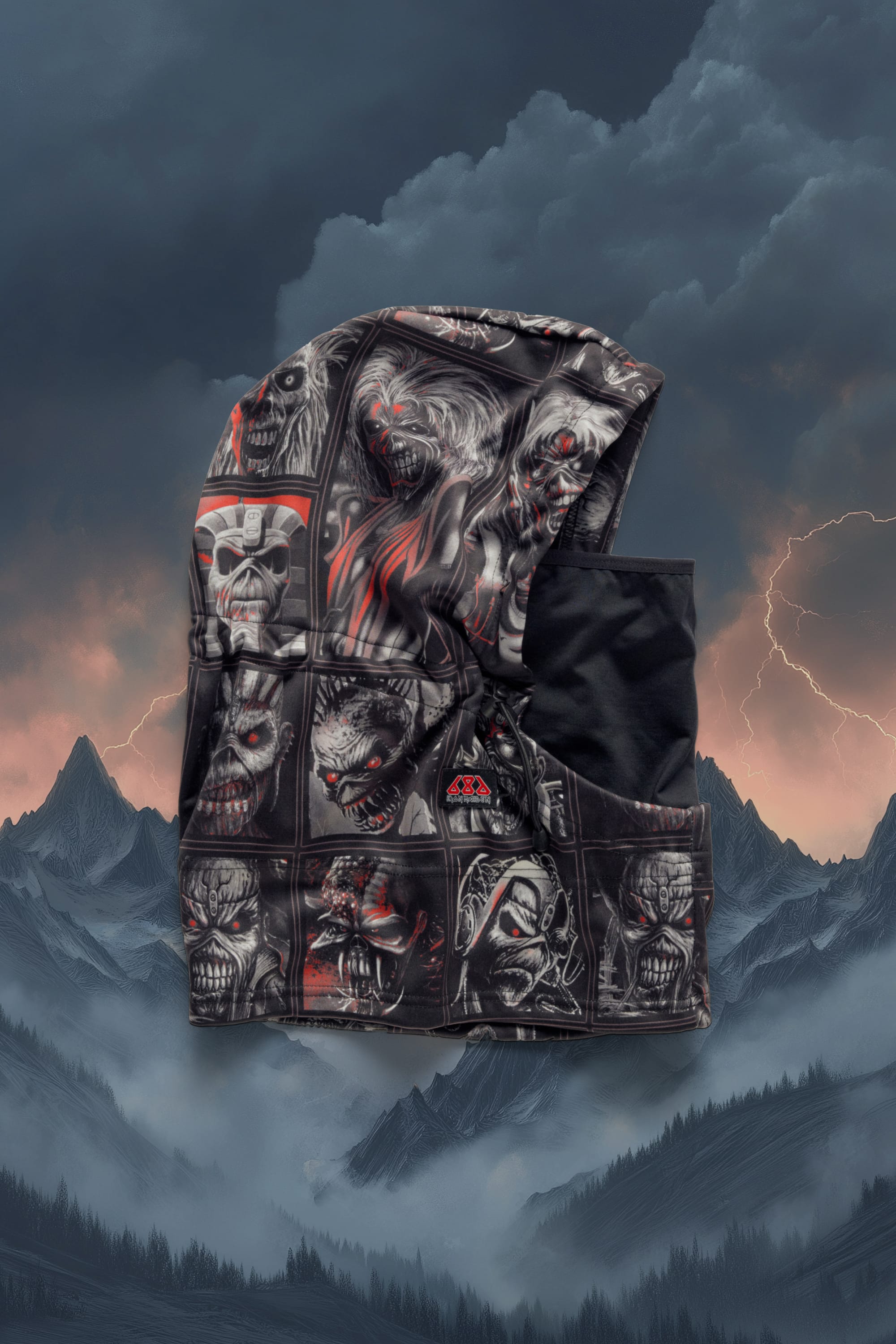 The 686 Patriot Bonded Hood by 686 is a black winter hood made from lightweight DWR fleece, showcasing illustrated horror faces and creatures set against stormy clouds, lightning, and dark mountains—a standout accessory.