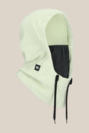 The 686 Tarmac Fleece Hood by 686 features a light green fleece, dark gray inner face covering, black drawstrings, and a small black logo tag—ideal for pairing with winter gear—displayed on a plain beige background.