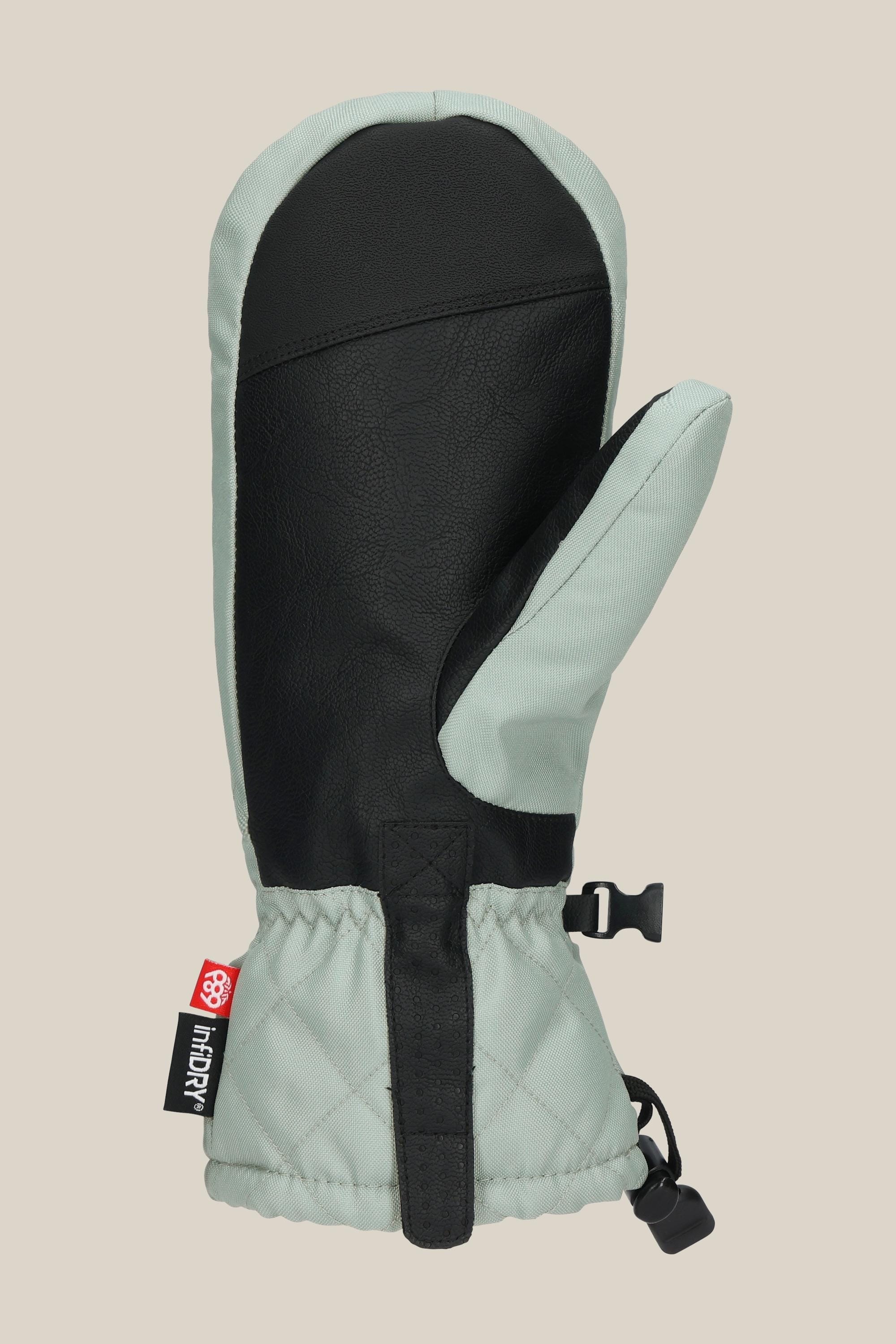 The 686 Womens Jubilee Mitt by 686 features a light gray fabric body, black leather palm and thumb, quilted cuff, black adjustable strap, light insulation, and a small black and red side tag.