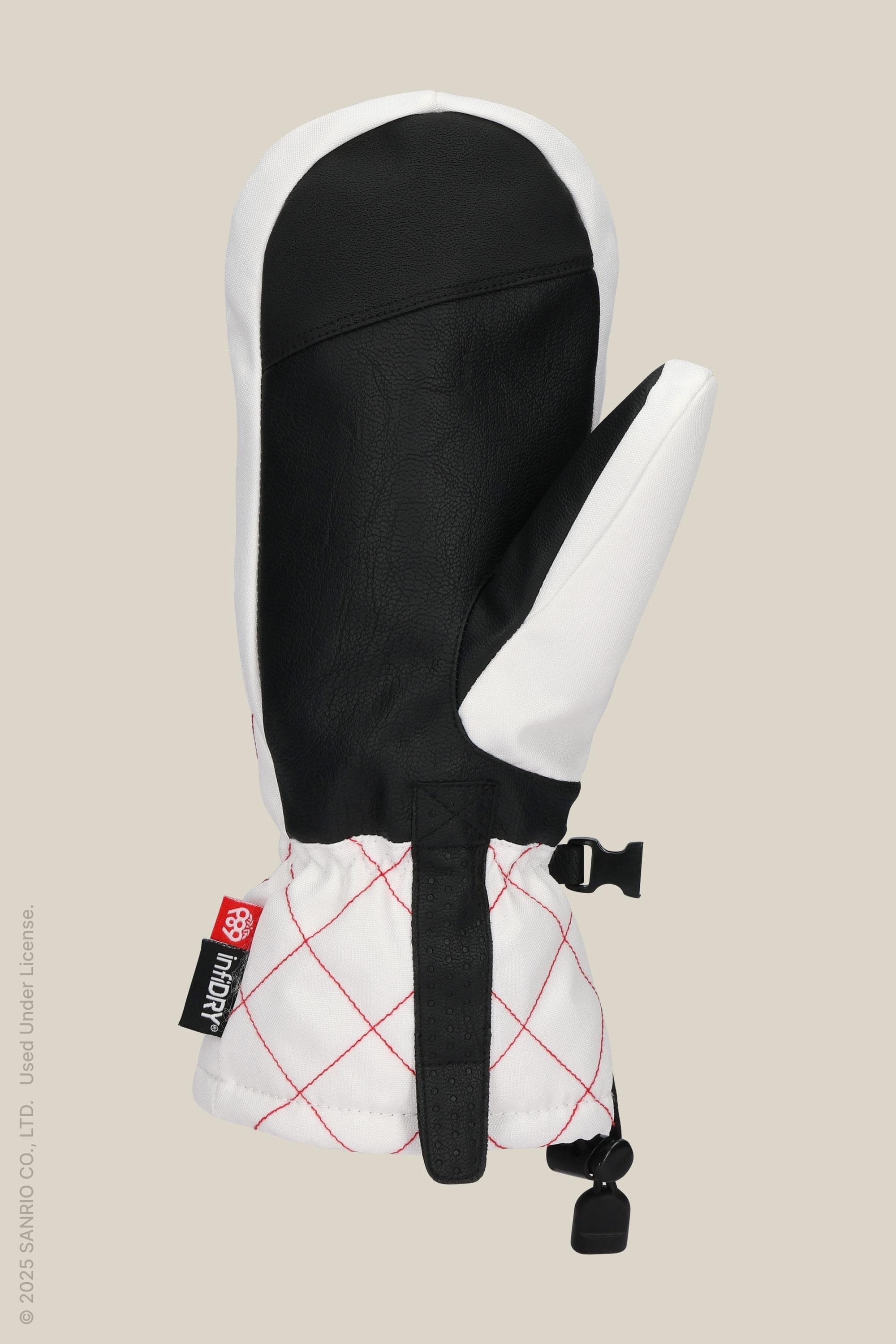The 686 Womens Jubilee Mitt by 686 features black-and-white waterproof fabric, light insulation, a red-stitched diamond cuff, elastic wrist, and a fastener clip at the bottom.