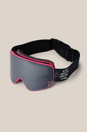 The 686 SMARTY® Magnetic Goggle by 686 features a pink frame, dark tinted lens, and black adjustable strap with white "ANTI SOCIAL SOCIAL CLUB" text, displayed on a plain beige background.