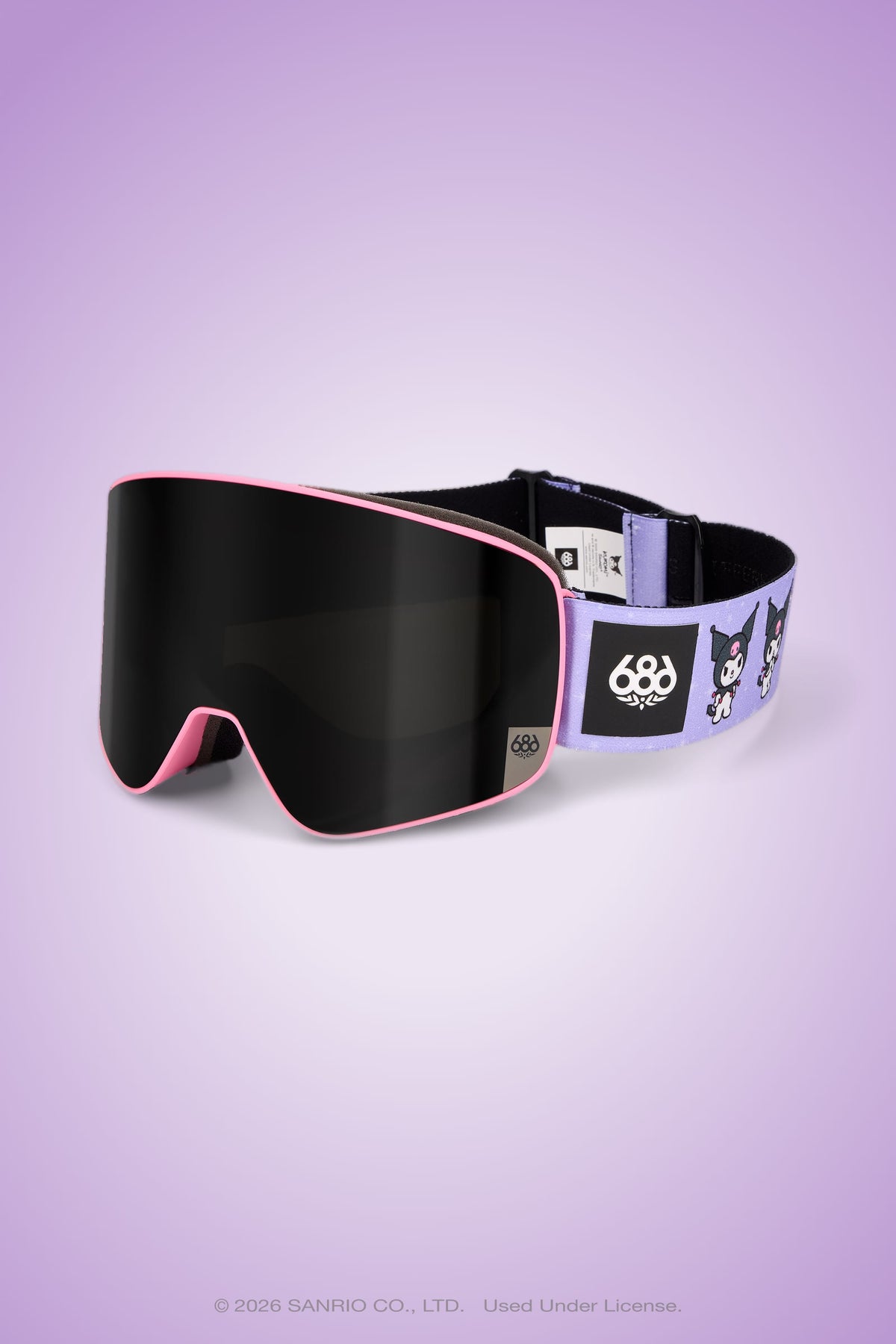 The 686 SMARTY® Magnetic Goggle by 686 features a pink frame, black lens, and a strap adorned with cartoon characters on a purple background. Designed for full-lens vision, these ski goggles are displayed on a light purple gradient backdrop.