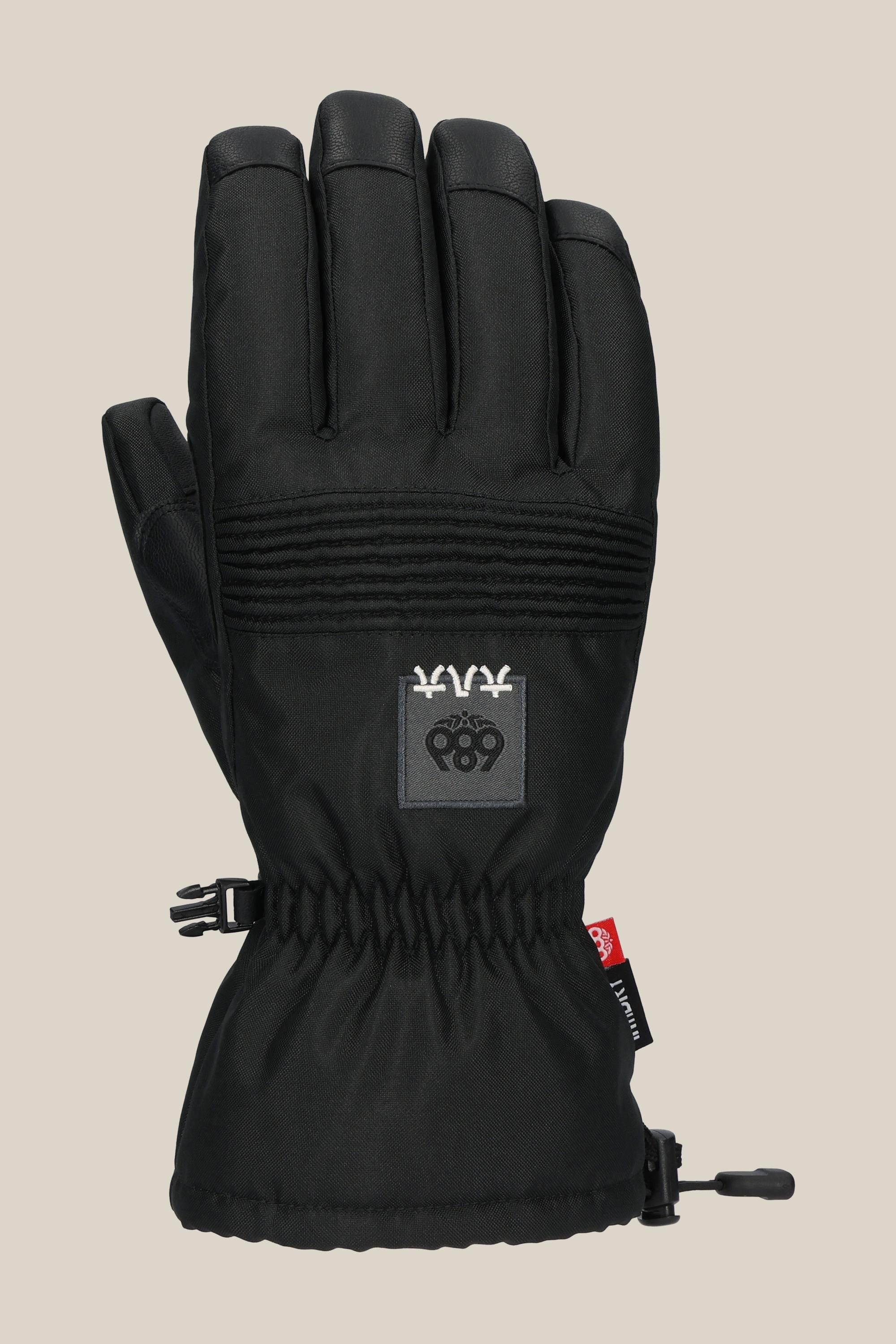 The 686 Lander Glove by 686 is a black winter glove with light insulation, reinforced fingers, an elastic wrist with a red fabric tag and adjustable cord, plus a logo patch on the back. It is shown against a plain beige background.