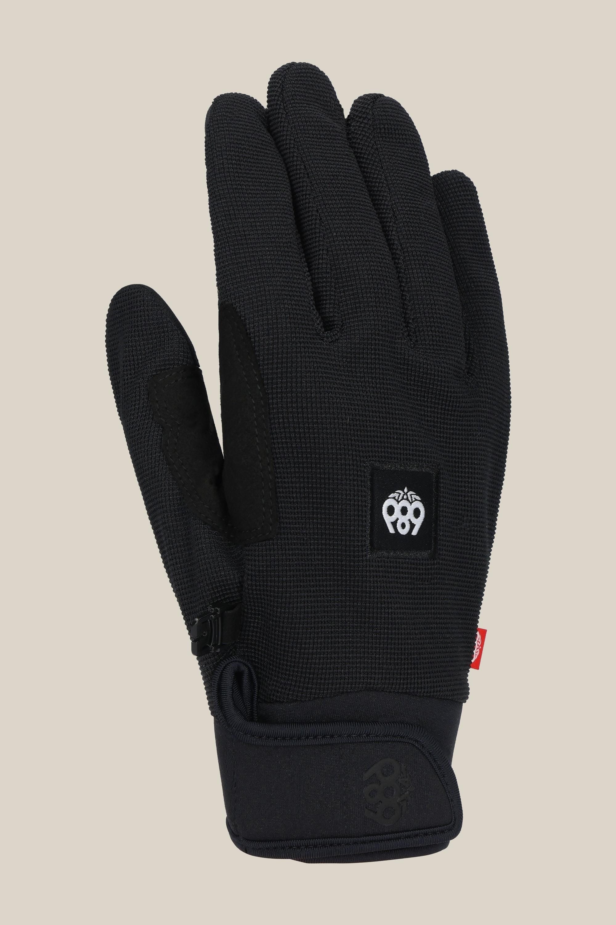 The 686 Mens Outlaw Pipe Glove by 686 features a black textured design, velcro wrist strap, small logo patch on the back, and reinforced grip areas on the palm and thumb, shown against a plain light beige background.