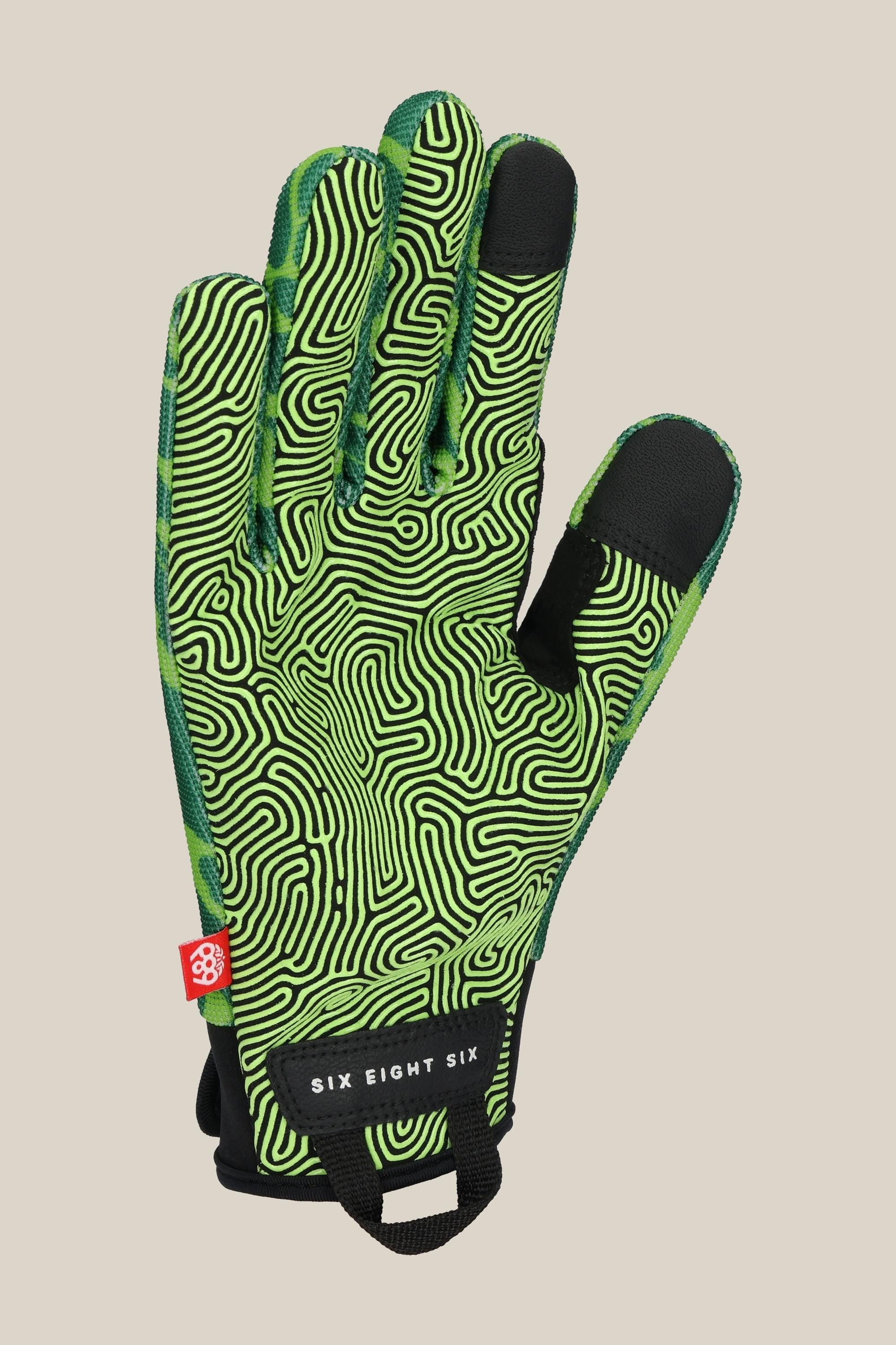 The 686 Men’s Outlaw Pipe Glove features a green design with bold black maze-like squiggles, enhanced black fingertip grip, a red side tag, and a black “SIX EIGHT SIX” label near the cuff.