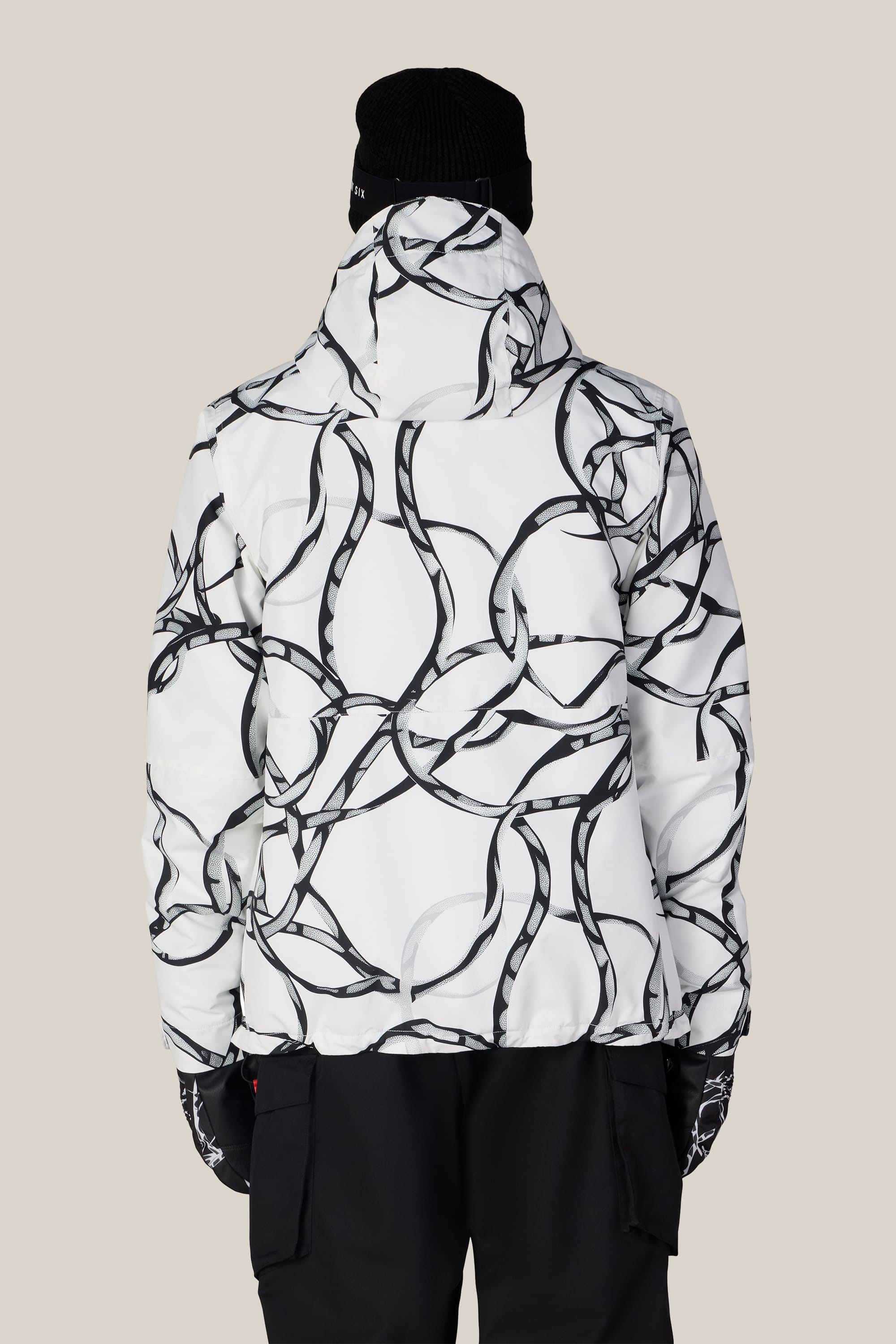A person is seen from behind against a plain light background, wearing the 686 Men’s Foundation™ Insulated Jacket by 686, paired with black gloves, black pants, and a black beanie.