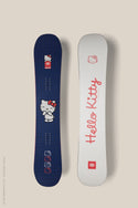 The 686 Hello Kitty Snowboard comes in two designs: one navy with a grid and large Hello Kitty graphic, and another white with red "Hello Kitty" script and a small Hello Kitty face at the top.