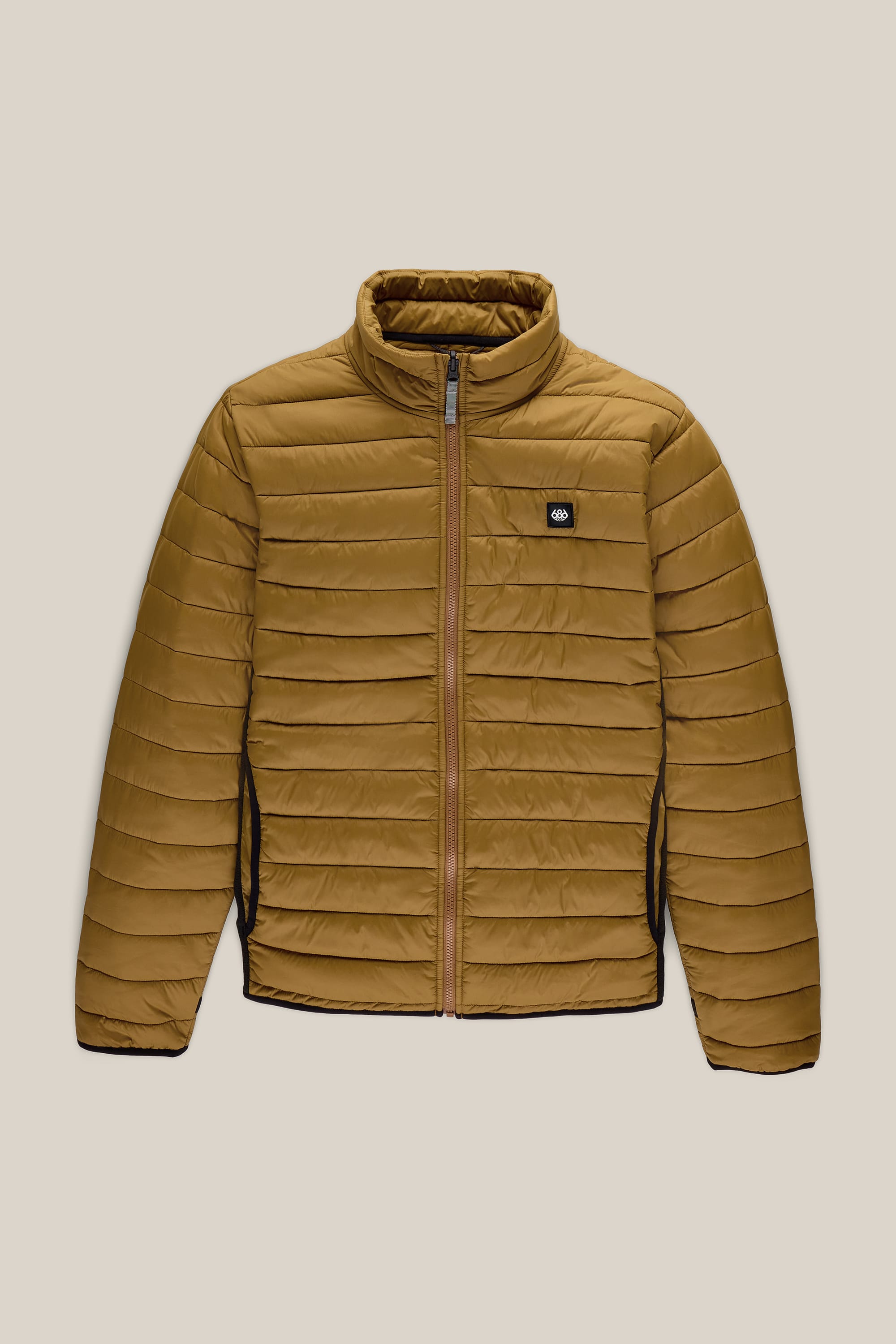 686 Men’s Thermal Puff Jacket by 686, featuring a brown color with horizontal quilting, front zipper closure, high collar, and a small black logo patch on the left chest, shown against a beige background.