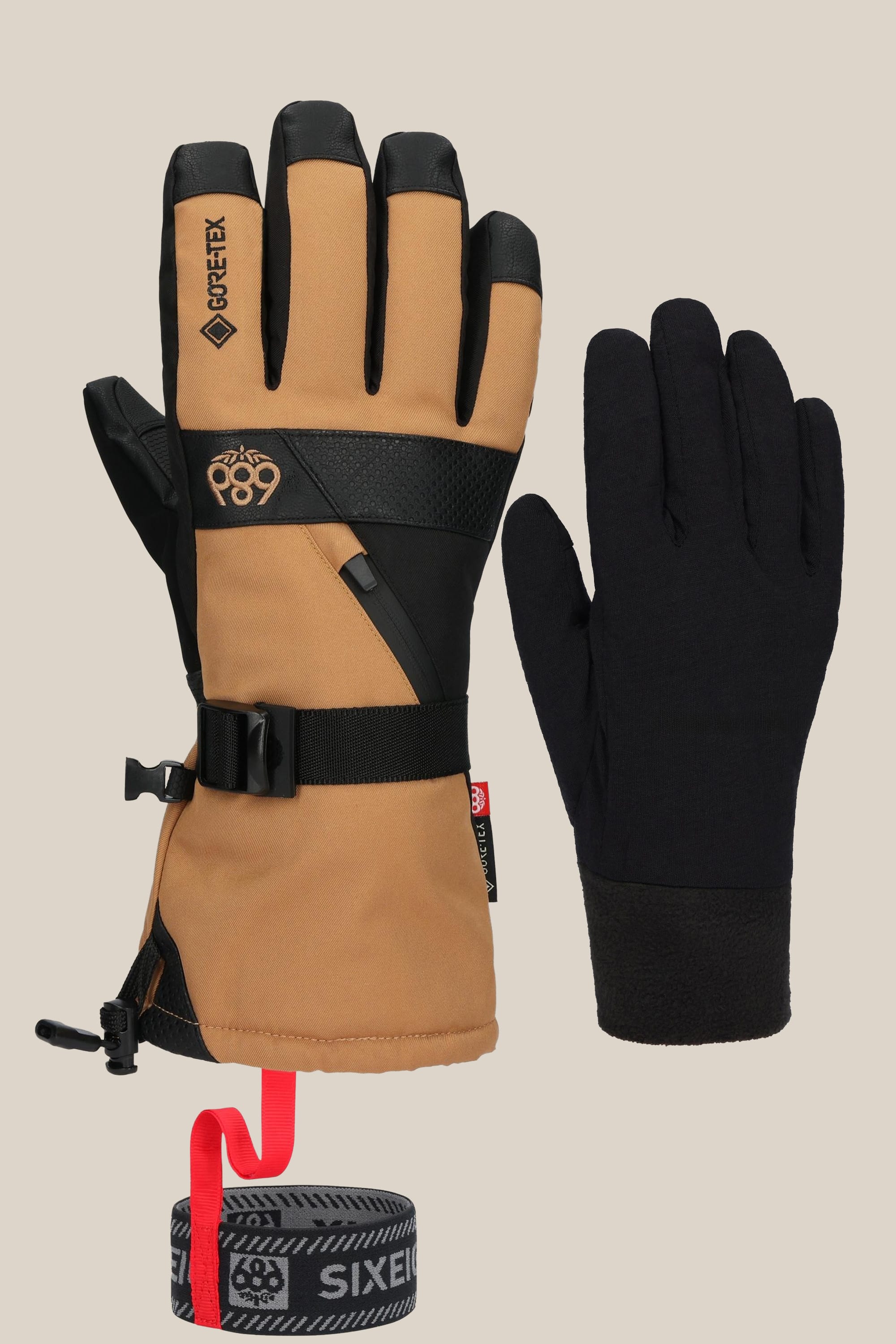 The 686 Mens GORE-TEX Smarty 3-In-1 Gauntlet Glove by 686 features an insulated tan and black mens glove with adjustable straps and logo, plus a plain black poly liner with a gray and red elastic wrist strap.