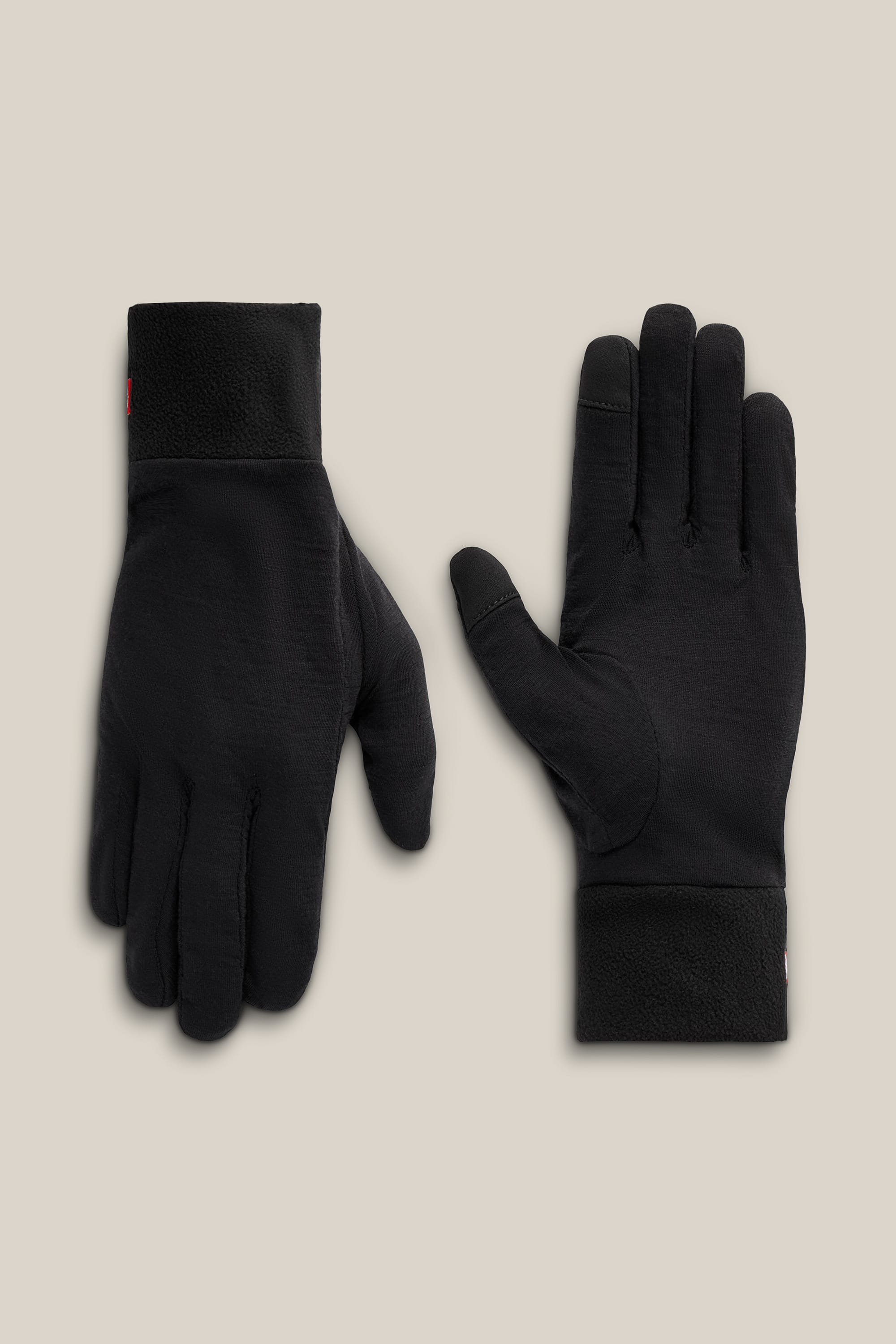 A pair of 686 Men’s GORE-TEX® SMARTY® 3-In-1 Gauntlet Gloves, one positioned palm up and the other palm down, displayed on a plain beige background.