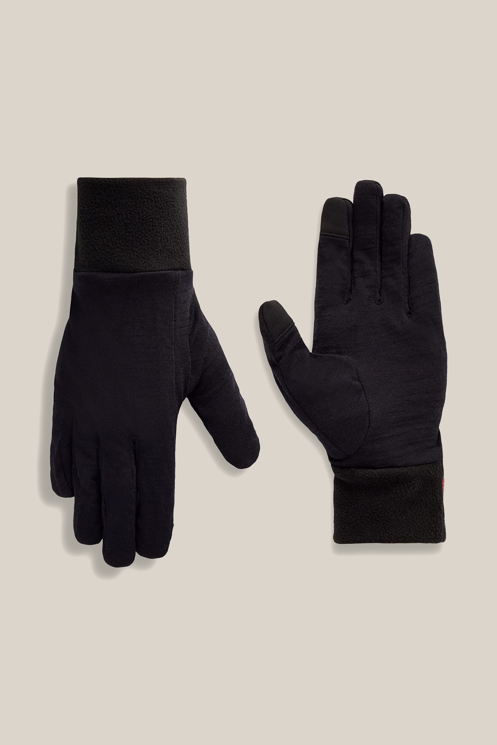 A pair of 686 Women’s GORE-TEX® SMARTY® 3-In-1 Gauntlet Gloves is laid flat on a light beige background, with one glove displaying the palm side and the other displaying the back side.