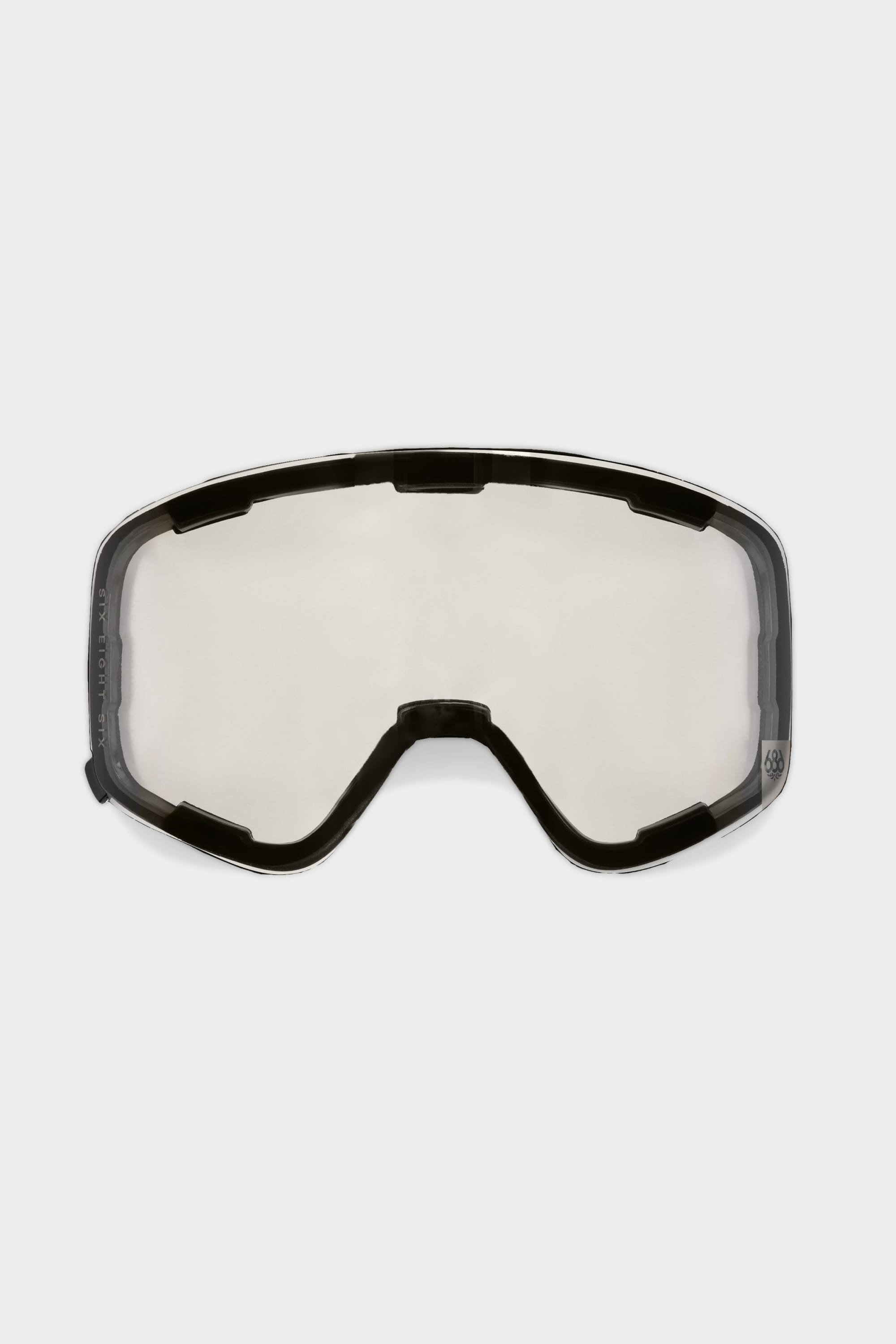 The 686 SMARTY Magnetic Goggle Replacement Lens by 686 features a clear, frameless design with black trim and a nose cutout. Its magnetic system allows for quick, easy lens swaps—ideal for seamless changes while skiing or snowboarding.