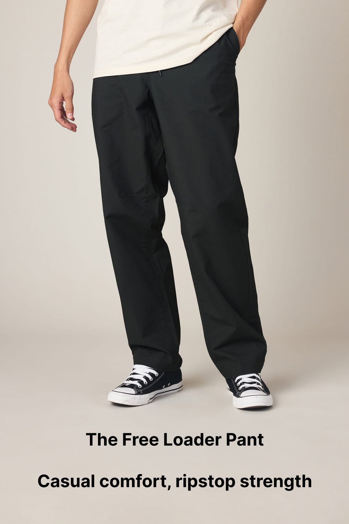 A person wears black ripstop pants and black sneakers, standing against a plain background. Text reads: The Free Loader Pant. Casual comfort, ripstop strength..