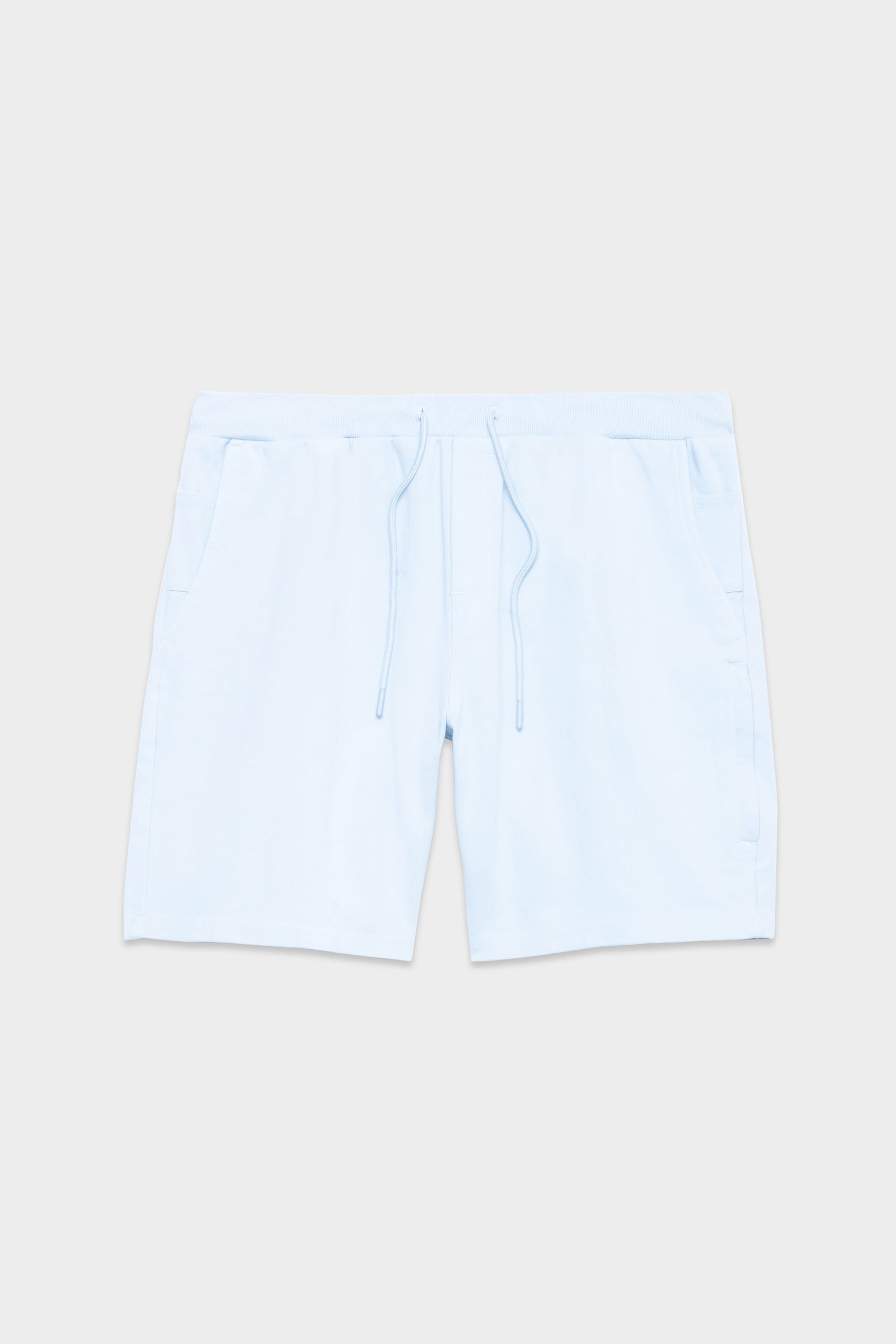 The 686 Mens Everywhere Double Knit Short by 686 is a light blue casual short with an elastic waistband, drawstring ties, and side pockets, shown flat on a plain light grey background.