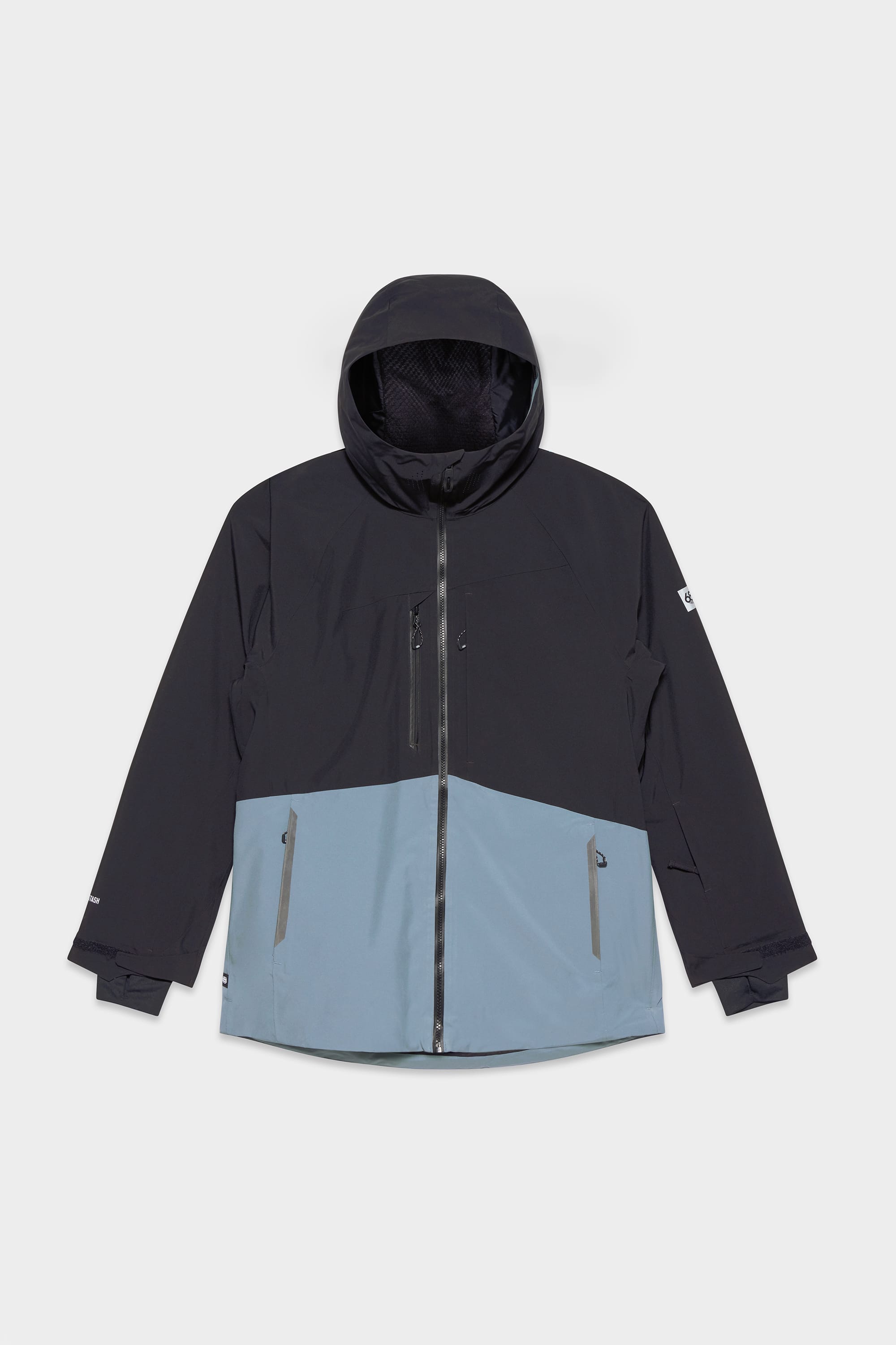 The 686 Men's Hydrastash Reserve Insulated Jacket features a black upper and sleeves, light blue lower section, waterproof polyester fabric, front zipper, zippered side pockets, and adjustable cuffs for comfort.